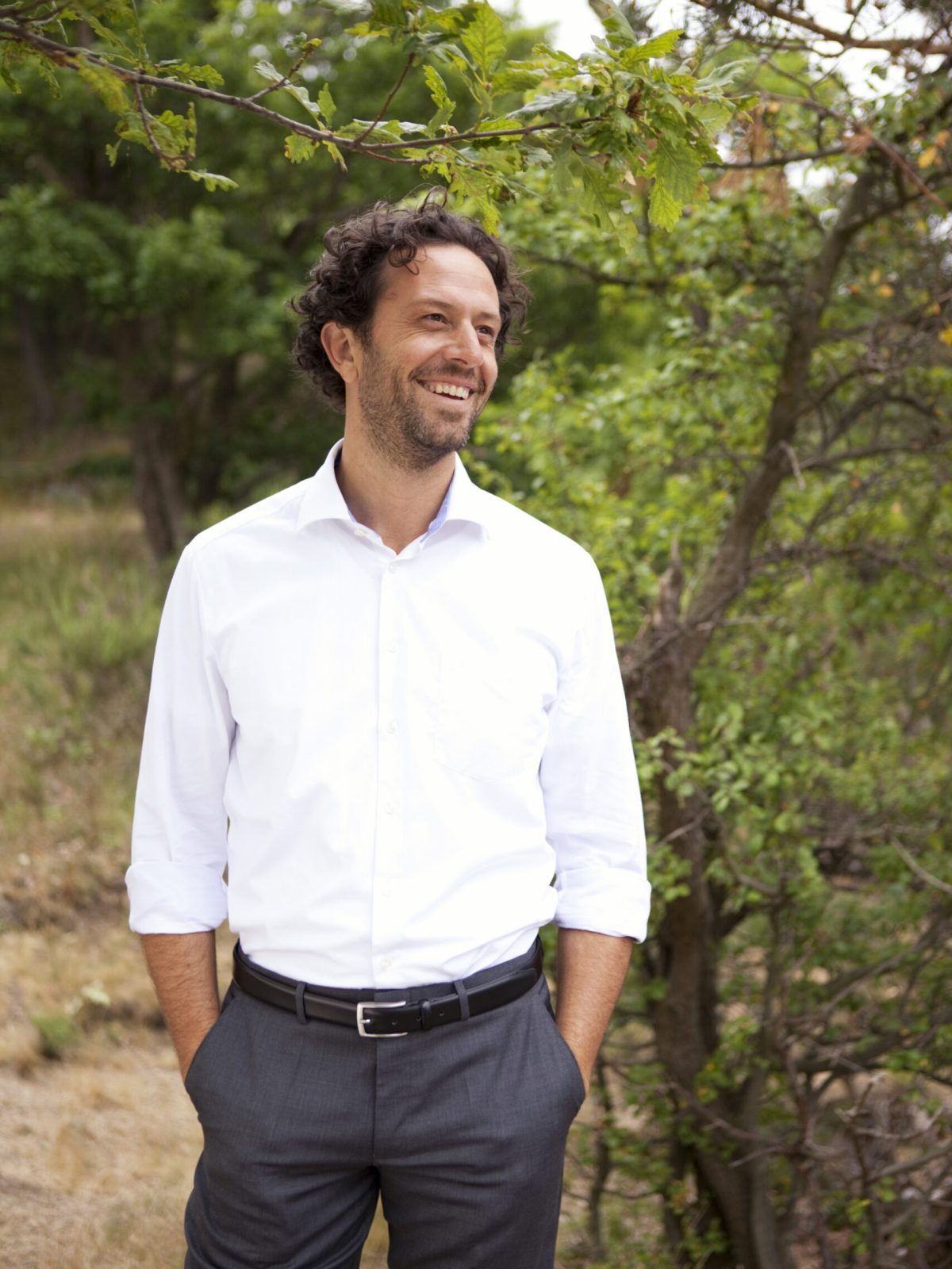 Germany, smiling businessman in forest